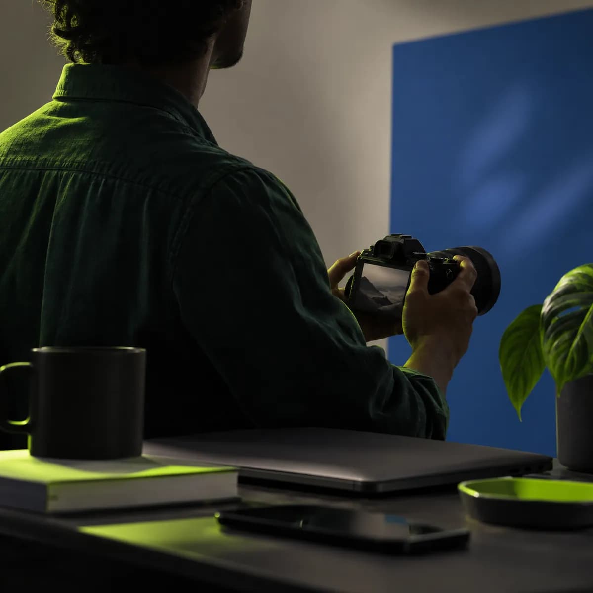 Abstract silhouette of a content creator in a dark green studio