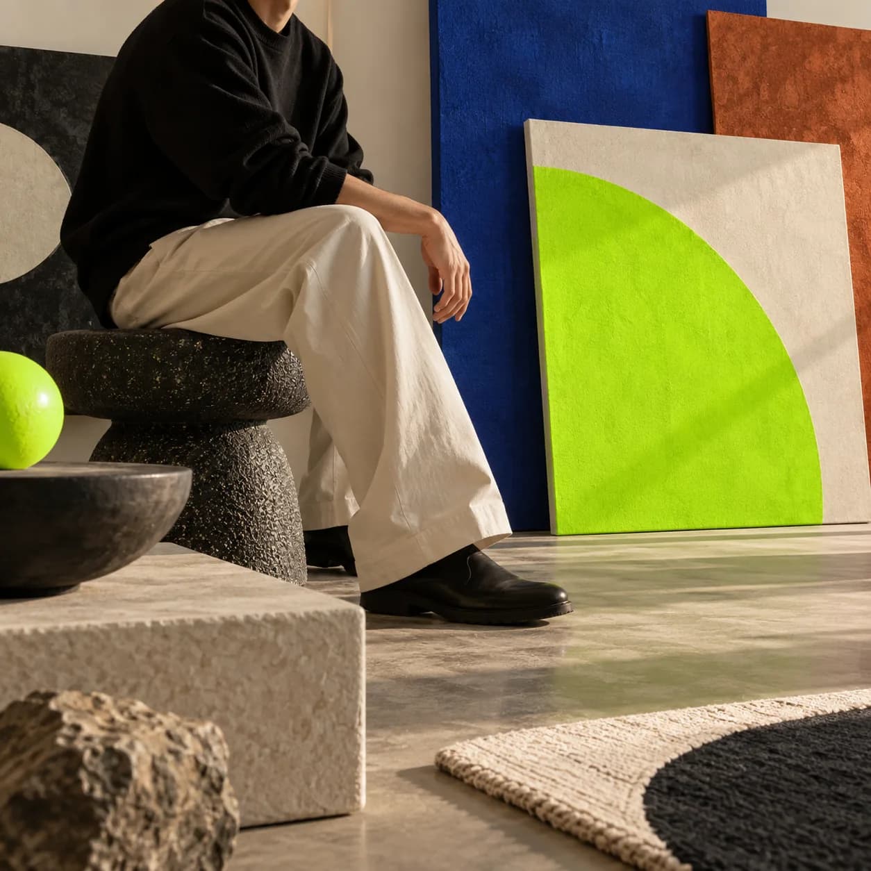 Abstract cinematic creative studio scene with layered lime panels and a cropped creator