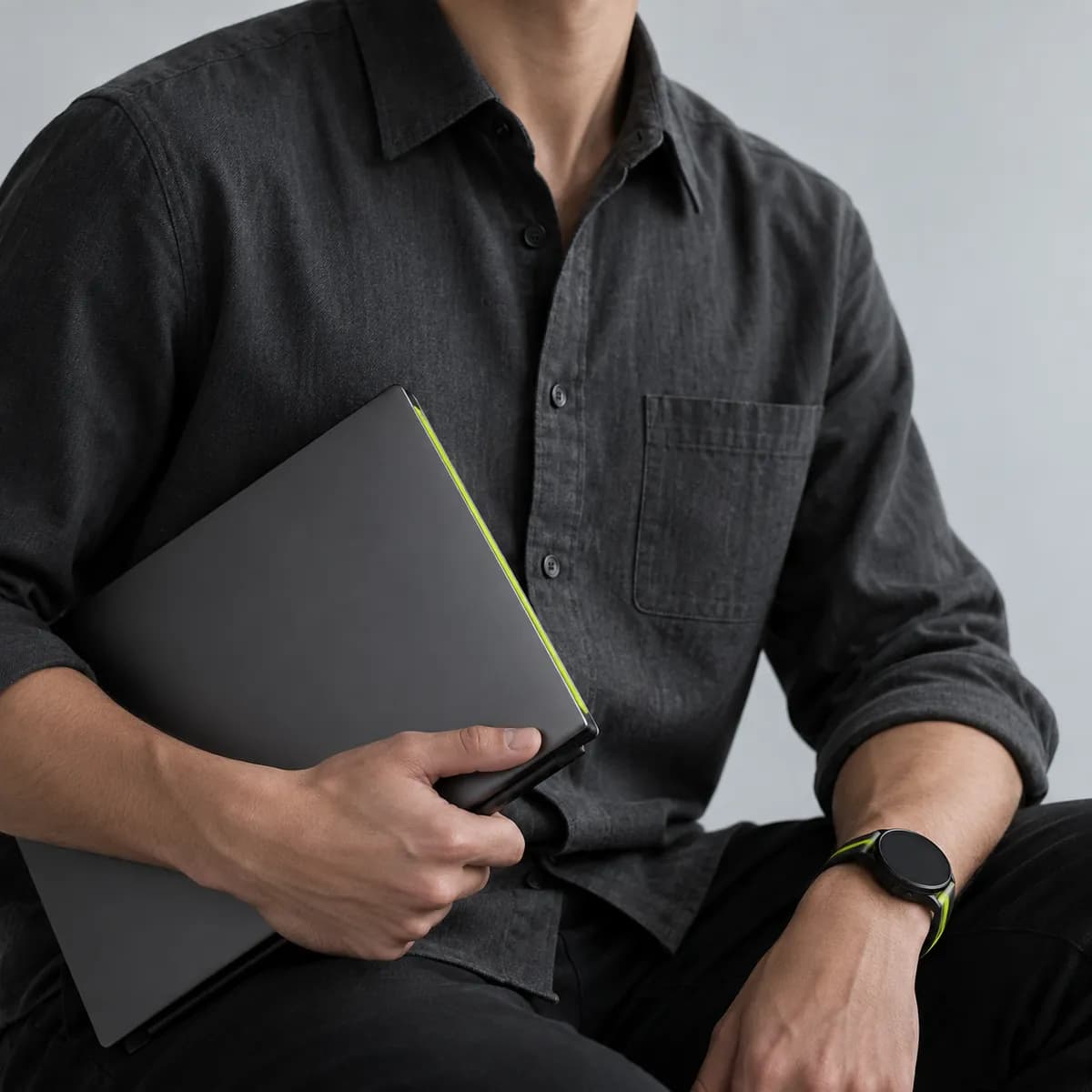 Creator cropped below the chin in a charcoal shirt