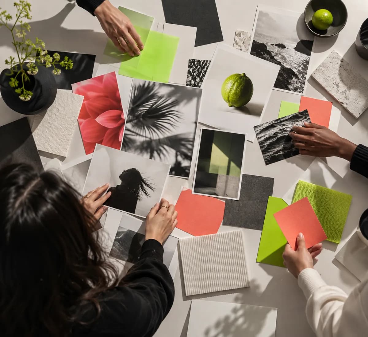 Hands arranging colorful creative materials for animated social content